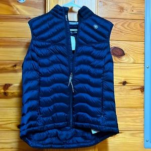 This is a dark blue, Ariat puffy vest